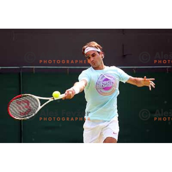Roger Federer of Switzerland in action during practice session at All England Lawn Tennis and Croquet Club in Wimbledon, London 2012 Summer Olympic games, Great Britain on July 25, 2012 