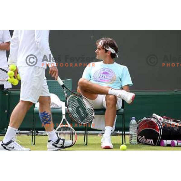 Roger Federer of Switzerland in action during practice session at All England Lawn Tennis and Croquet Club in Wimbledon, London 2012 Summer Olympic games, Great Britain on July 25, 2012 