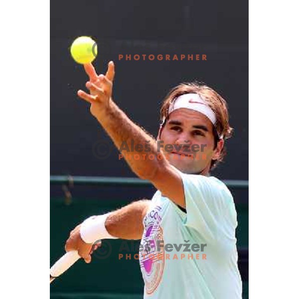 Roger Federer of Switzerland in action during practice session at All England Lawn Tennis and Croquet Club in Wimbledon, London 2012 Summer Olympic games, Great Britain on July 25, 2012 