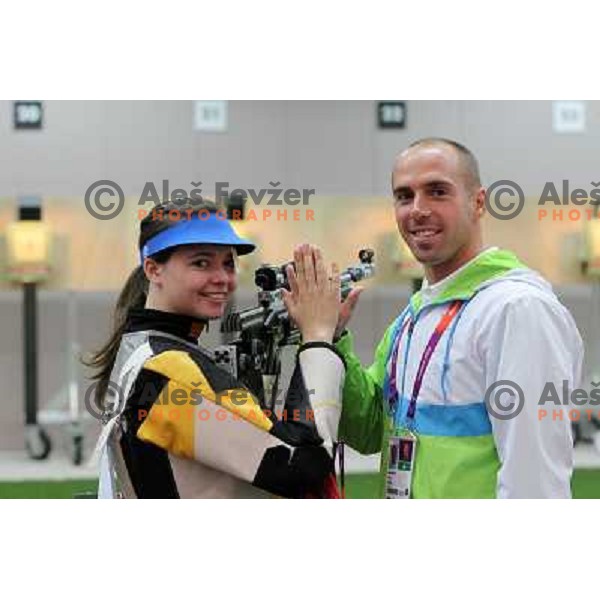 Shooter Ziva Dvorsak and coach David Zalar of Slovenia during practice session in shooting complex of The Royal Artillery Barracks during London 2012 Summer Olympic Games in London, Great Britain on July 26, 2012 