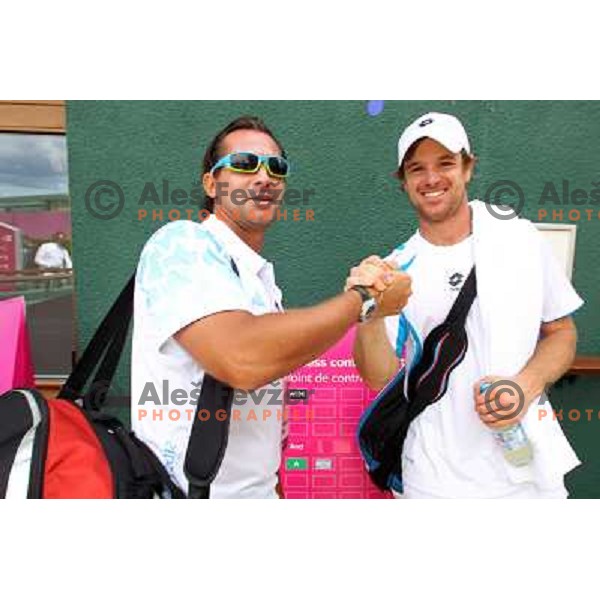 Blaz Trupej and Blaz Kavcic of Slovenia after first round of tennis tournament in Wimbledon during London 2012 Summer Olympic Games, Great Britain on July 30, 2012 