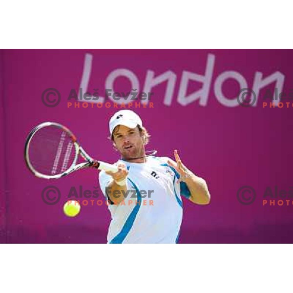 Blaz Kavcic of Slovenia in action in first round of tennis tournament in Wimbledon during London 2012 Summer Olympic Games, Great Britain on July 30, 2012 