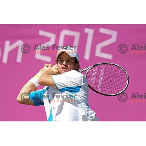 Blaz Kavcic of Slovenia in action in first round of tennis tournament in Wimbledon during London 2012 Summer Olympic Games, Great Britain on July 30, 2012 