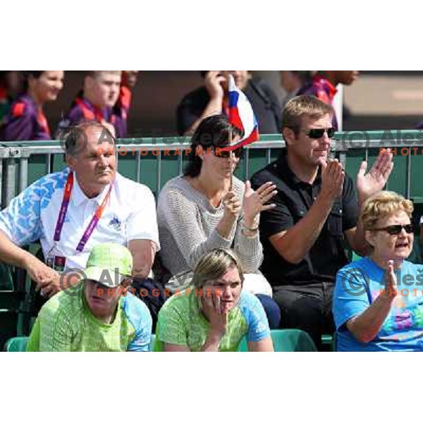 Fans cheering for Blaz Kavcic of Slovenia in first round of tennis tournament in Wimbledon during London 2012 Summer Olympic Games, Great Britain on July 30, 2012 
