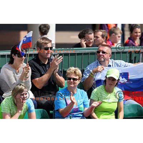 Fans cheering for Blaz Kavcic of Slovenia in first round of tennis tournament in Wimbledon during London 2012 Summer Olympic Games, Great Britain on July 30, 2012 
