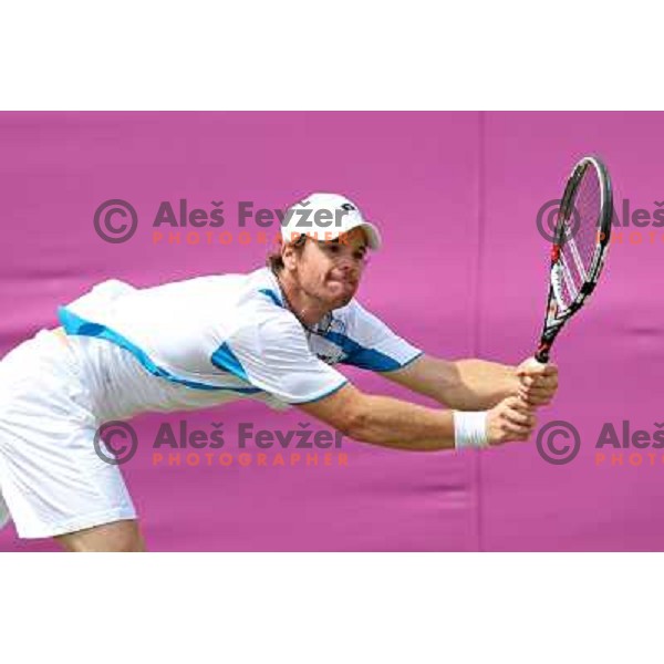 Blaz Kavcic of Slovenia in action in first round of tennis tournament in Wimbledon during London 2012 Summer Olympic Games, Great Britain on July 30, 2012 