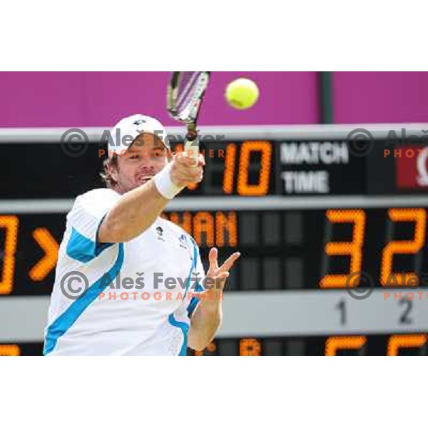 Blaz Kavcic of Slovenia in action in first round of tennis tournament in Wimbledon during London 2012 Summer Olympic Games, Great Britain on July 30, 2012 