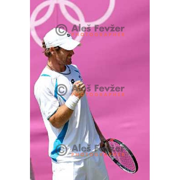 Blaz Kavcic of Slovenia in action in first round of tennis tournament in Wimbledon during London 2012 Summer Olympic Games, Great Britain on July 30, 2012 