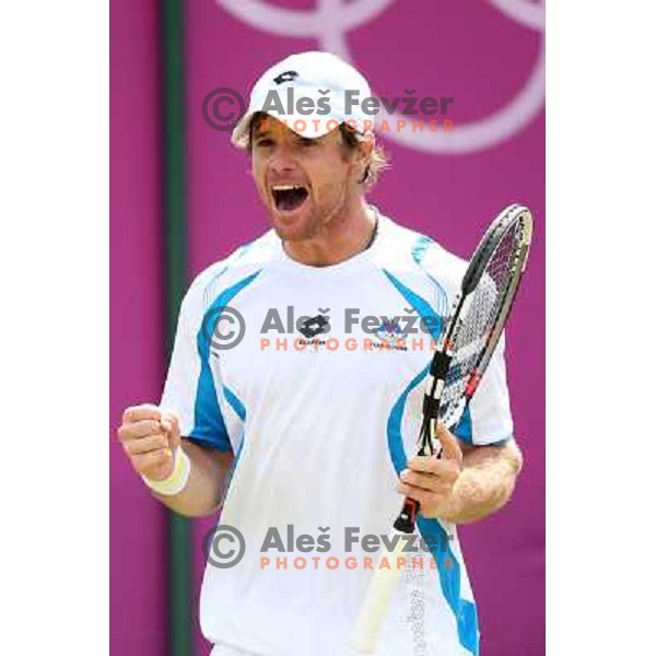 Blaz Kavcic of Slovenia in action in first round of tennis tournament in Wimbledon during London 2012 Summer Olympic Games, Great Britain on July 30, 2012 