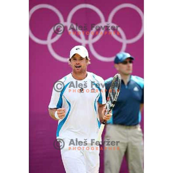 Blaz Kavcic of Slovenia in action in first round of tennis tournament in Wimbledon during London 2012 Summer Olympic Games, Great Britain on July 30, 2012 