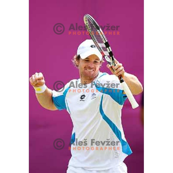 Blaz Kavcic of Slovenia in action in first round of tennis tournament in Wimbledon during London 2012 Summer Olympic Games, Great Britain on July 30, 2012 