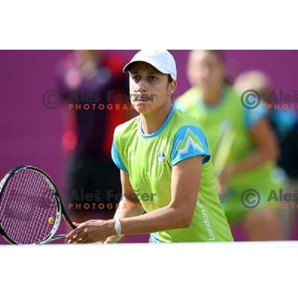 Katarina Srebotnik of Slovenia in action in first round of women\'s doubles tennis tournament in Wimbledon during London 2012 Summer Olympic Games, Great Britain on July 30, 2012 