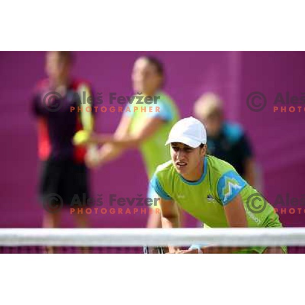 Katarina Srebotnik of Slovenia in action in first round of women\'s doubles tennis tournament in Wimbledon during London 2012 Summer Olympic Games, Great Britain on July 30, 2012 