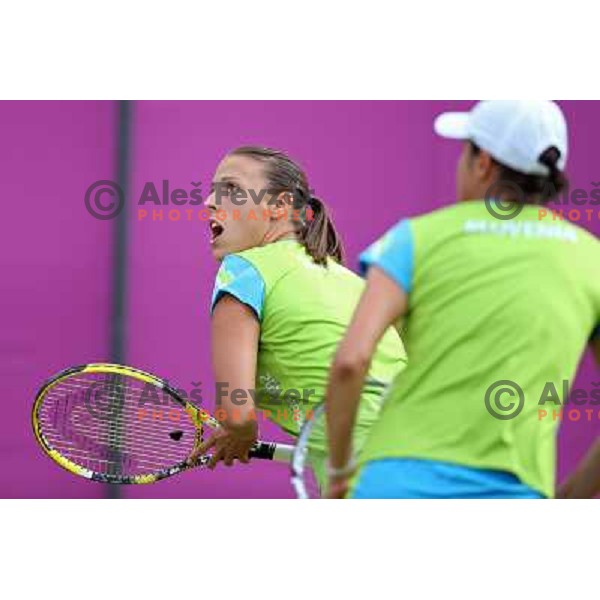 Andreja Klepac of Slovenia in action in first round of women\'s doubles tennis tournament in Wimbledon during London 2012 Summer Olympic Games, Great Britain on July 30, 2012 