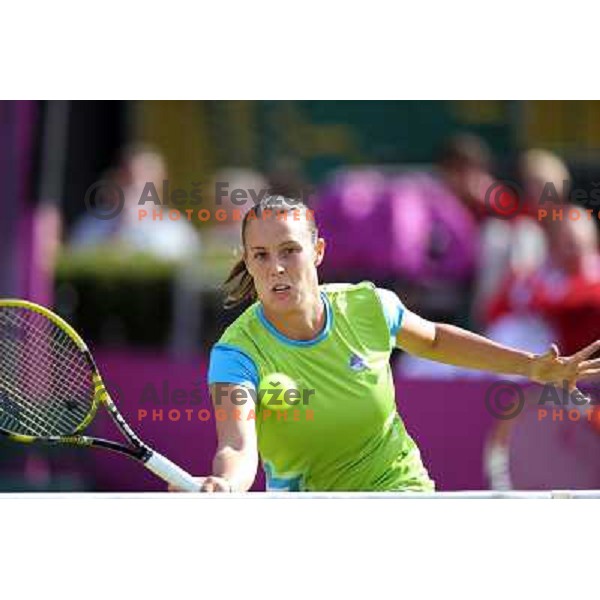 Andreja Klepac of Slovenia in action in first round of women\'s doubles tennis tournament in Wimbledon during London 2012 Summer Olympic Games, Great Britain on July 30, 2012 