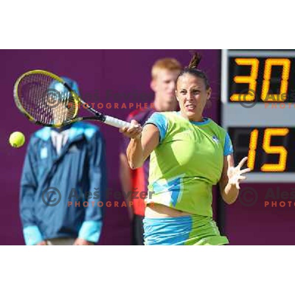 Andreja Klepac of Slovenia in action in first round of women\'s doubles tennis tournament in Wimbledon during London 2012 Summer Olympic Games, Great Britain on July 30, 2012 