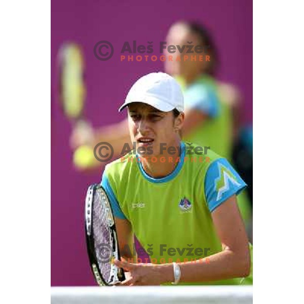 Katarina Srebotnik of Slovenia in action in first round of women\'s doubles tennis tournament in Wimbledon during London 2012 Summer Olympic Games, Great Britain on July 30, 2012 