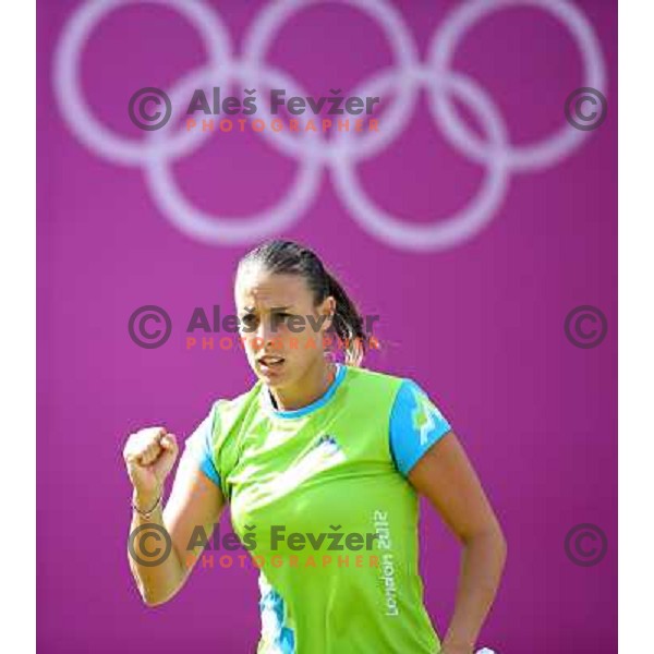 Andreja Klepac of Slovenia in action in first round of women\'s doubles tennis tournament in Wimbledon during London 2012 Summer Olympic Games, Great Britain on July 30, 2012 