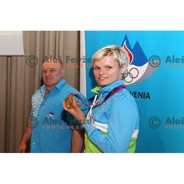 Urska Zolnir and coach Marjan Fabjan of Slovenia at medal reception in Slovenia pub in Camden during London 2012 Summer Olympic games on 1st of August, 2012 