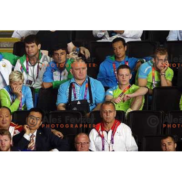 Urska Zolnir, Marjan Fabjan, Rok Draksic watching in third round of women\'s -70 kg judo tournament during London 2012 Summer Olympic games on 1st of August, 2012 