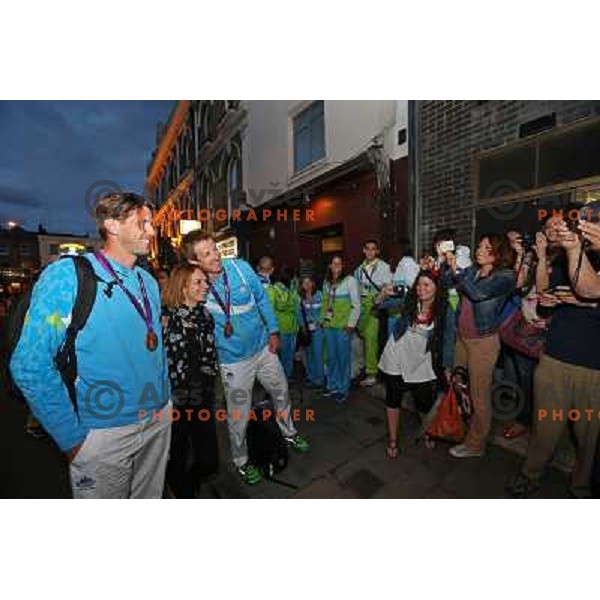 Iztok Cop and Luka Spik of Slovenia, Olympic bronze medalists in double sculls at Eton Dorney celebrate their medal with fans in Slovenia pub in Camden during London 2012 Summer Olympic games, Great Britain on 2nd of August 2012 