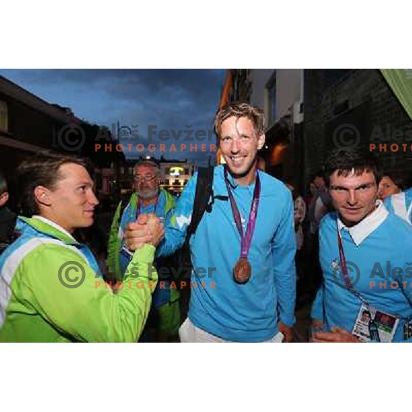 Luka Bozic, Luka Spik of Slovenia, Olympic bronze medalist in double sculls at Eton Dorney, Peter Kauzer celebrate medal with fans in Slovenia pub in Camden during London 2012 Summer Olympic games, Great Britain on 2nd of August 2012 