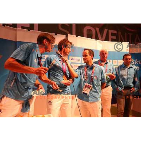Iztok Cop and Luka Spik of Slovenia, Olympic bronze medalists in double sculls at Eton Dorney celebrate their medal with fans in Slovenia pub in Camden during London 2012 Summer Olympic games, Great Britain on 2nd of August 2012 