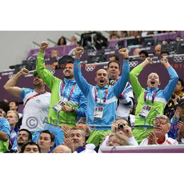 Blaz Perko, Matej Zupanc, David Zalar, Ziva Dvorsak cheer at shooting 50 meters Rifle Prone men at Royal Artillery Barracks during London 2012 Summer Olympic games, Great Britain on August 3,2012 