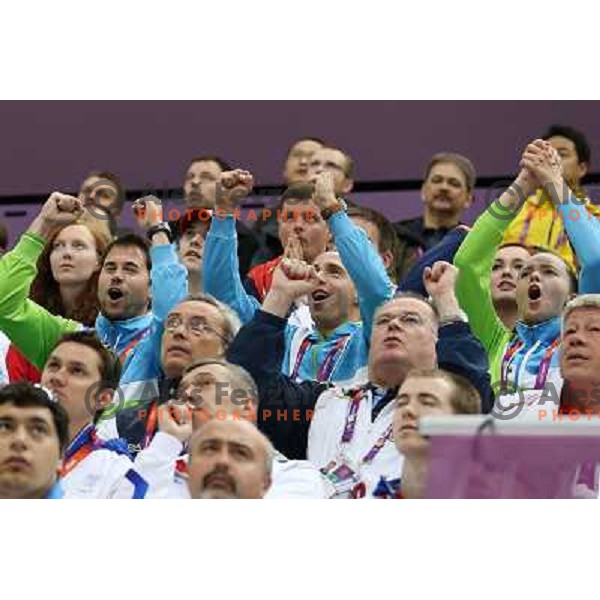 Matej Zupanc, David Zalar, Ziva Dvorsak cheer at men\'s 50 m Rifle Prone shooting competition at Royal Artillery Barracks, London 2012 Olympic games, Great Britain on August 3, 2012 