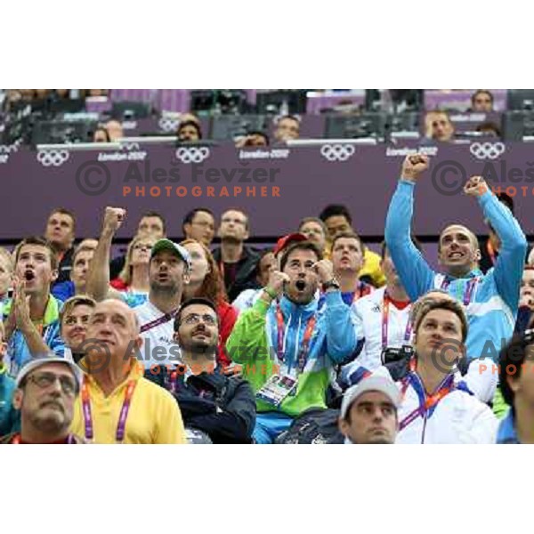 Klemen Strajhar, Blaz Perko, Matej Zupanc, David Zalar cheer at men\'s 50 m Rifle Prone shooting competition at Royal Artillery Barracks, London 2012 Olympic games, Great Britain on August 3, 2012 