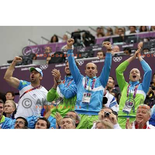Blaz Perko, Matej Zupanc, David Zalar, Ziva Dvorsak cheer at men\'s 50 m Rifle Prone shooting competition at Royal Artillery Barracks, London 2012 Olympic games, Great Britain on August 3, 2012 