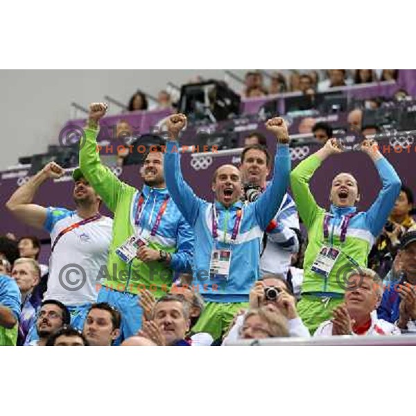 Klemen Strajhar, Blaz Perko, Matej Zupanc, David Zalar, Ziva Dvorsak cheer at men\'s 50 m Rifle Prone shooting competition at Royal Artillery Barracks, London 2012 Olympic games, Great Britain on August 3, 2012 