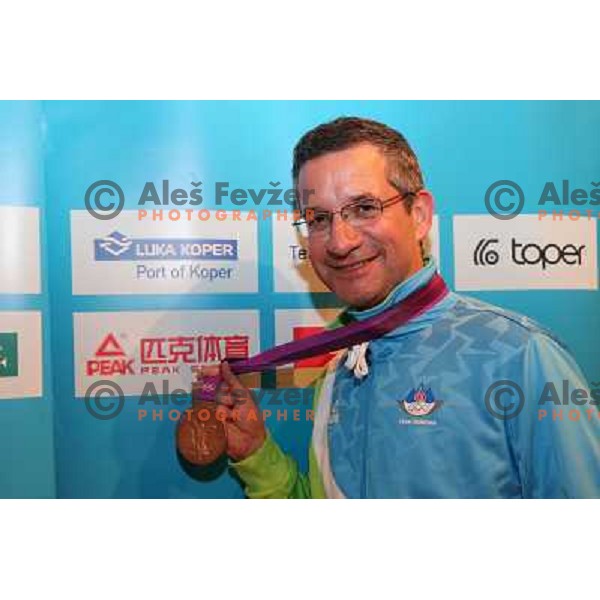 Rajmond Debevec celebrates his bronze olympic medal in shooting with fans and sponsors of OKS in Slovenia pub in Camden during London 2012 Summer Olympic Games, Great Britain on August 3, 2012 