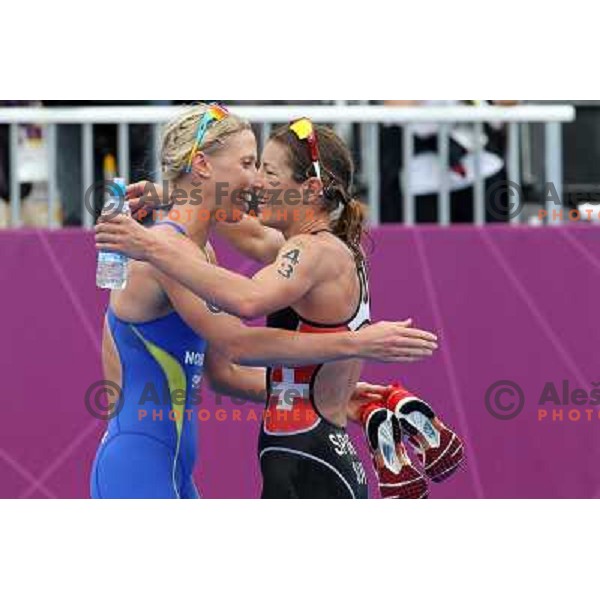 Nicola Spirig (SUI, nr.43)Olympic gold medalist and Lisa Norden (SWE,nr.20) silver medalist compete in women\'s triathlon in Hyde Park during London 2012 Summer Olympic Games, Great Britain on August 4, 2012 