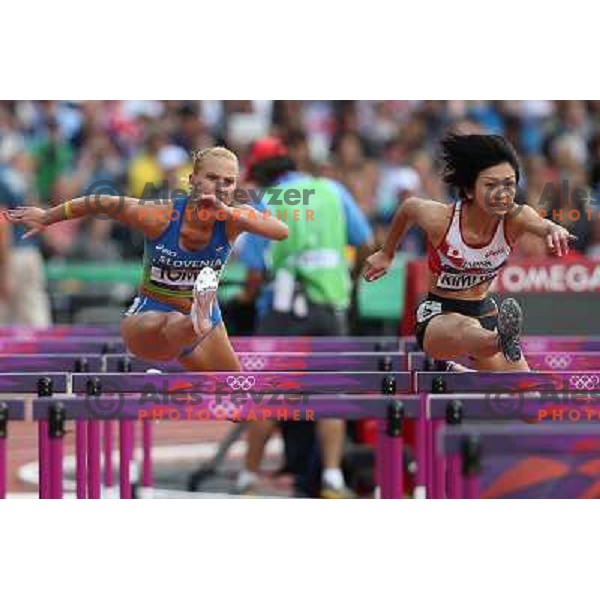 Marina Tomic of Slovenia runs in qualification heat of women\'s 100 meters hurdles at Olympic stadium during London 2012 Summer Olympic games, Great Britain on August 6,2012 