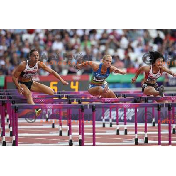 Marina Tomic of Slovenia runs in qualification heat of women\'s 100 meters hurdles at Olympic stadium during London 2012 Summer Olympic games, Great Britain on August 6,2012 