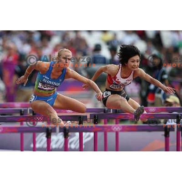 Marina Tomic of Slovenia runs in qualification heat of women\'s 100 meters hurdles at Olympic stadium during London 2012 Summer Olympic games, Great Britain on August 6,2012 