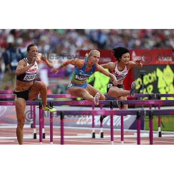 Marina Tomic of Slovenia runs in qualification heat of women\'s 100 meters hurdles at Olympic stadium during London 2012 Summer Olympic games, Great Britain on August 6,2012 