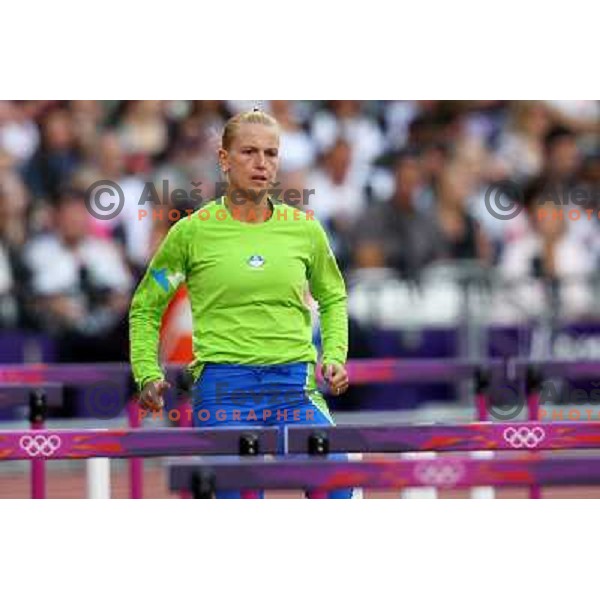 Marina Tomic of Slovenia runs in qualification heat of women\'s 100 meters hurdles at Olympic stadium during London 2012 Summer Olympic games, Great Britain on August 6,2012 
