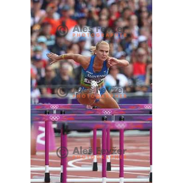 Marina Tomic of Slovenia runs in qualification heat of women\'s 100 meters hurdles at Olympic stadium during London 2012 Summer Olympic games, Great Britain on August 6,2012 