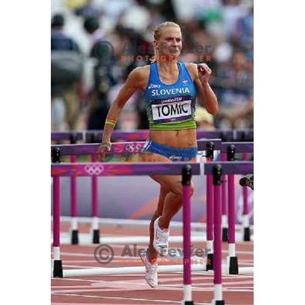 Marina Tomic of Slovenia runs in qualification heat of women\'s 100 meters hurdles at Olympic stadium during London 2012 Summer Olympic games, Great Britain on August 6,2012 