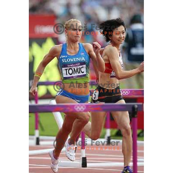 Marina Tomic of Slovenia runs in qualification heat of women\'s 100 meters hurdles at Olympic stadium during London 2012 Summer Olympic games, Great Britain on August 6,2012 