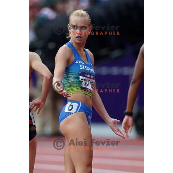 Marina Tomic of Slovenia runs in qualification heat of women\'s 100 meters hurdles at Olympic stadium during London 2012 Summer Olympic games, Great Britain on August 6,2012 