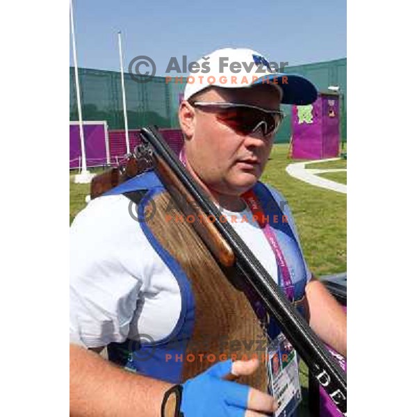 Bostjan Macek of Slovenia competes in trap at shooting range of Royal Artillery Barracks during London 2012 Olympic games on August 6, 2012 