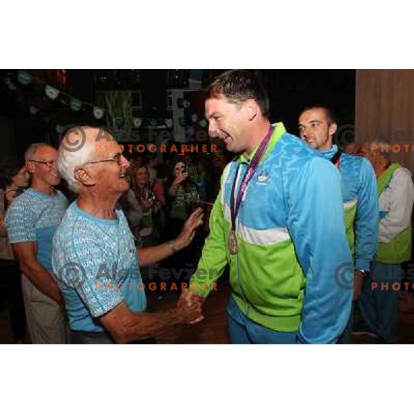 Primoz Kozmus of Slovenia, Olympic silver medalist in hammer throw celebrates his medal with fans in Slovenia pub in Camden during London 2012 Summer Olympic games, Great Britain on August,6 2012 
