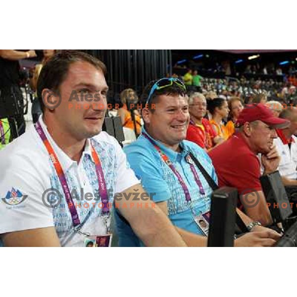 Primoz Kozmus and coach Andrej Hajnsek watch the final of women\'s javelin throw at Olympic Stadium during London 2012 Summer Olympic Games, Great Britain on August 9, 2012 