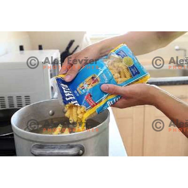 Urban Ferencak prepares lunch in apartment of hotel Camelia in Southend on Sea, british town and seaside resort in Essex during London 2012 Summer Olympic games on August 9, 2012 