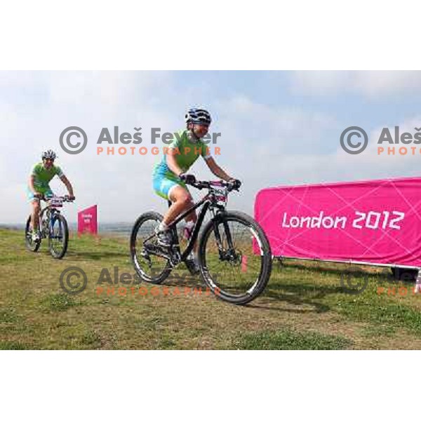 Coach Urban Ferencak and Tanja Zakelj of Slovenia during free practice session on Olympic MTB course at Hadleigh Farm near Southend on Sea,Essex during London 2012 Summer Olympic games on August 9, 2012 