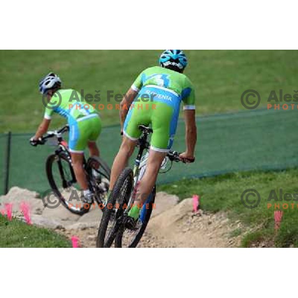 Coach Urban Ferencak and Tanja Zakelj of Slovenia during free practice session on Olympic MTB course at Hadleigh Farm near Southend on Sea,Essex during London 2012 Summer Olympic games on August 9, 2012 