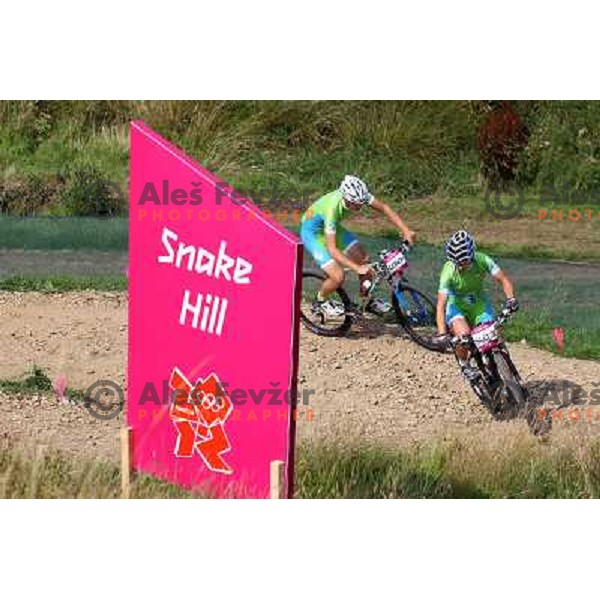 Coach Urban Ferencak and Tanja Zakelj of Slovenia during free practice session on Olympic MTB course at Hadleigh Farm near Southend on Sea,Essex during London 2012 Summer Olympic games on August 9, 2012 